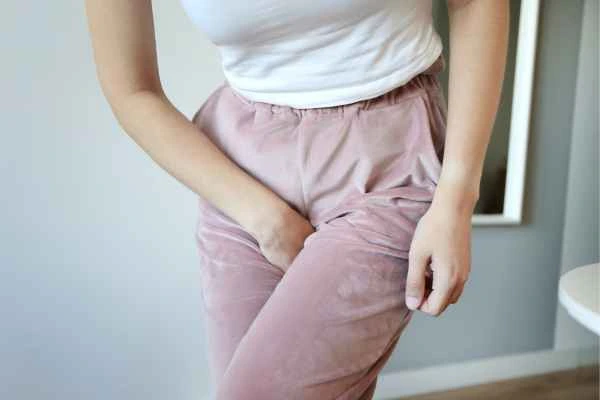 older woman running to the toilet because of urinary incontinence Livingston